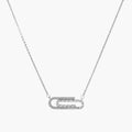 White gold plated necklace with dual-frame geometric pendant featuring crystal pavé border on pale background.