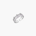 Silver-toned adjustable crown ring with channel-set square zirconia stones and delicate floral details on white background