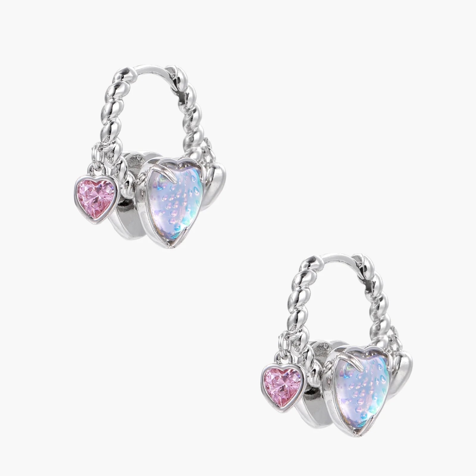 Silver chain hoop earrings with iridescent opal heart charms and pink zirconia accents on white background