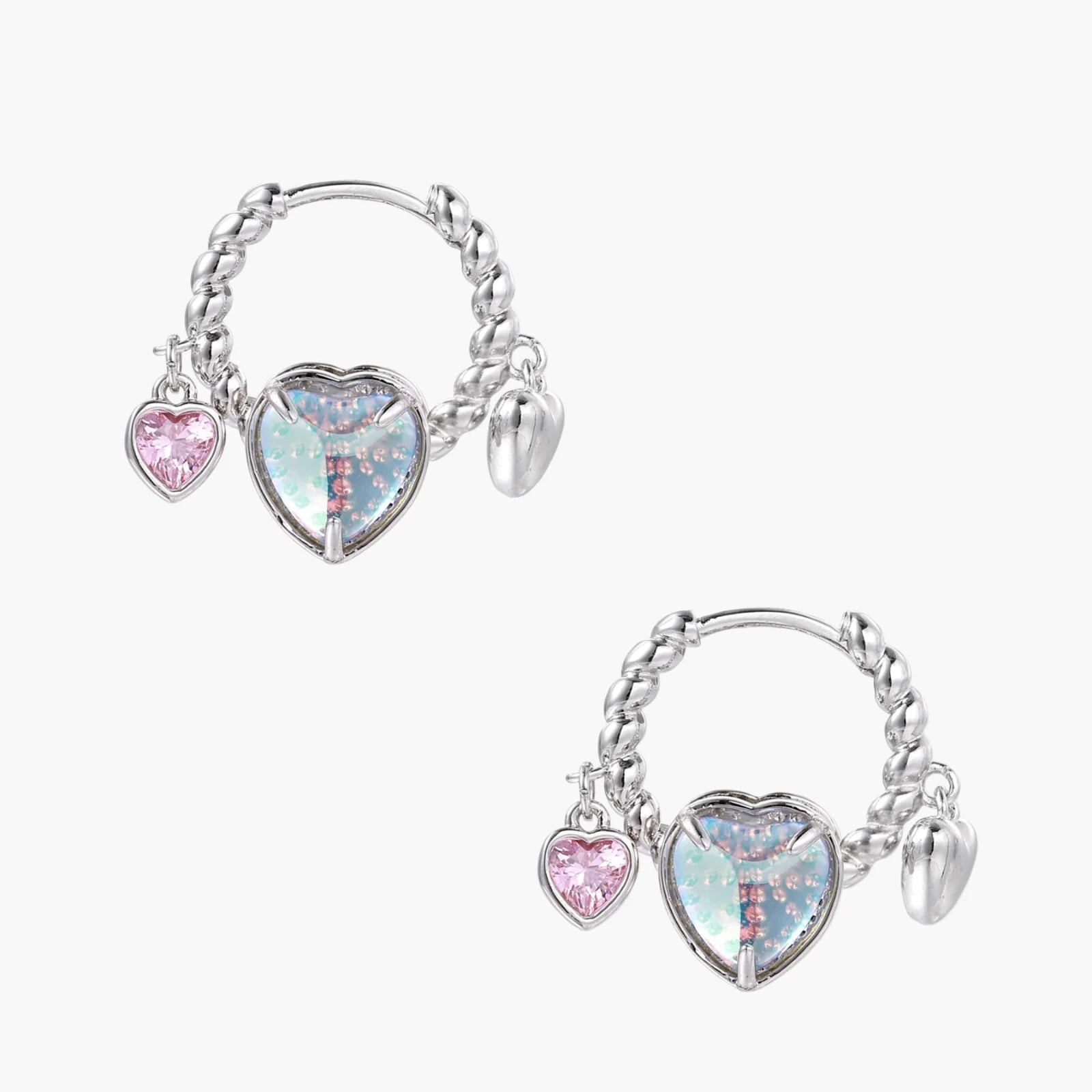 Silver chain hoop earrings with iridescent opal heart charms and pink zirconia accents on white background