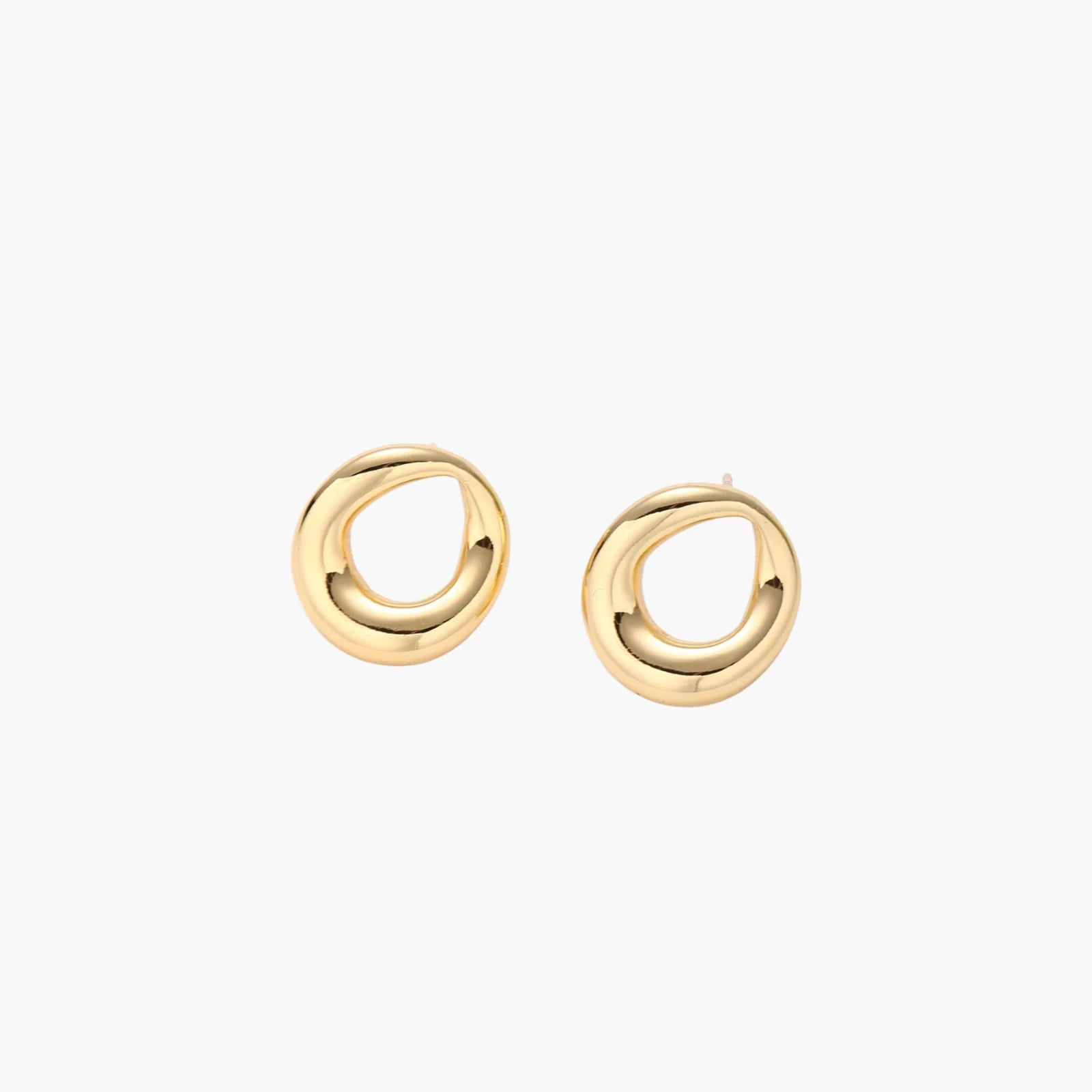 Pair of polished 18K gold-plated stainless steel teardrop earrings with hollow centers on cream background