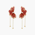 Red enamel flower earrings with gold-plated stems, central pearl, and gradient coral-to-gold petals on white background