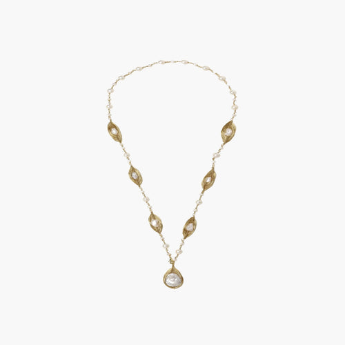 14K gold-plated necklace with eye-shaped stations and baroque pearl pendant on cream background