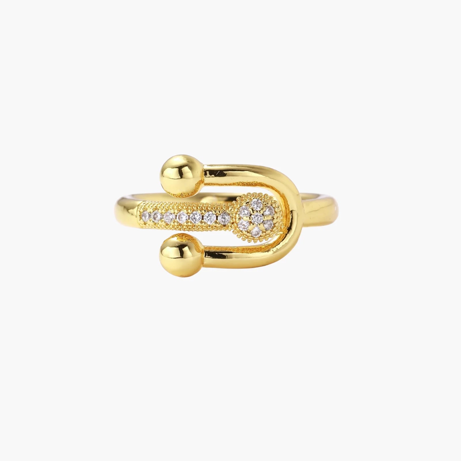 Gold-plated brass ring with safety pin design featuring pavé cubic zirconia stones and dual sphere ends