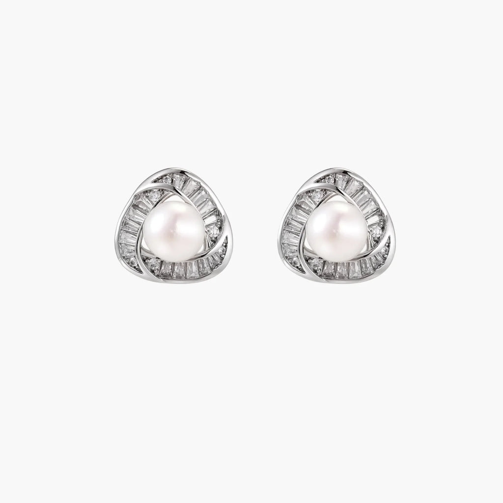 Triangular white gold plated stud earrings with central freshwater pearl and baguette-cut stones on white background
