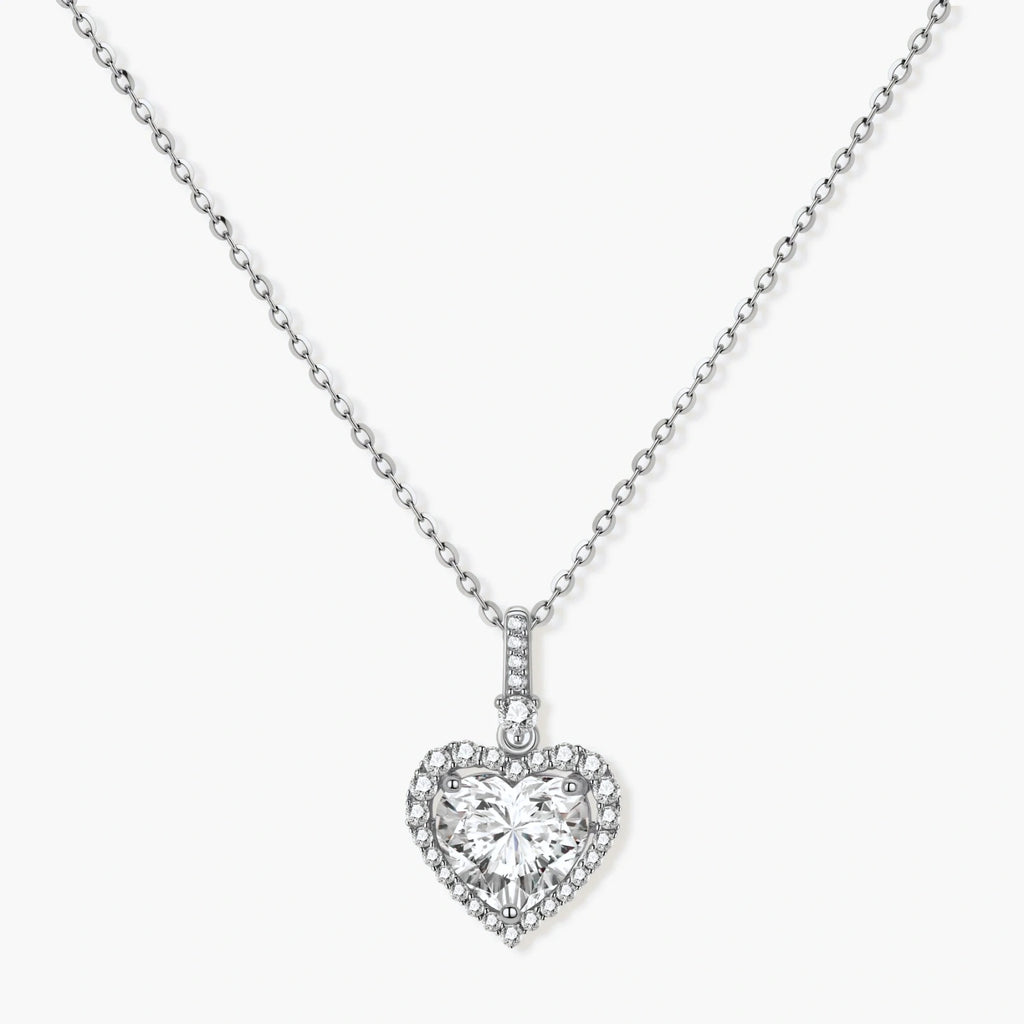 Sterling silver heart pendant necklace with brilliant moissanite center stone and halo setting on delicate chain