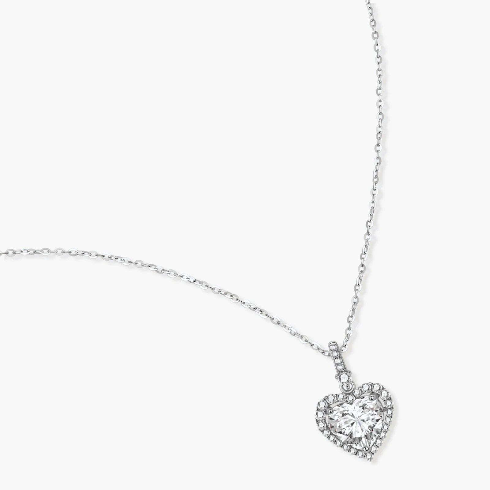 Sterling silver heart pendant necklace with brilliant moissanite center stone and halo setting on delicate chain