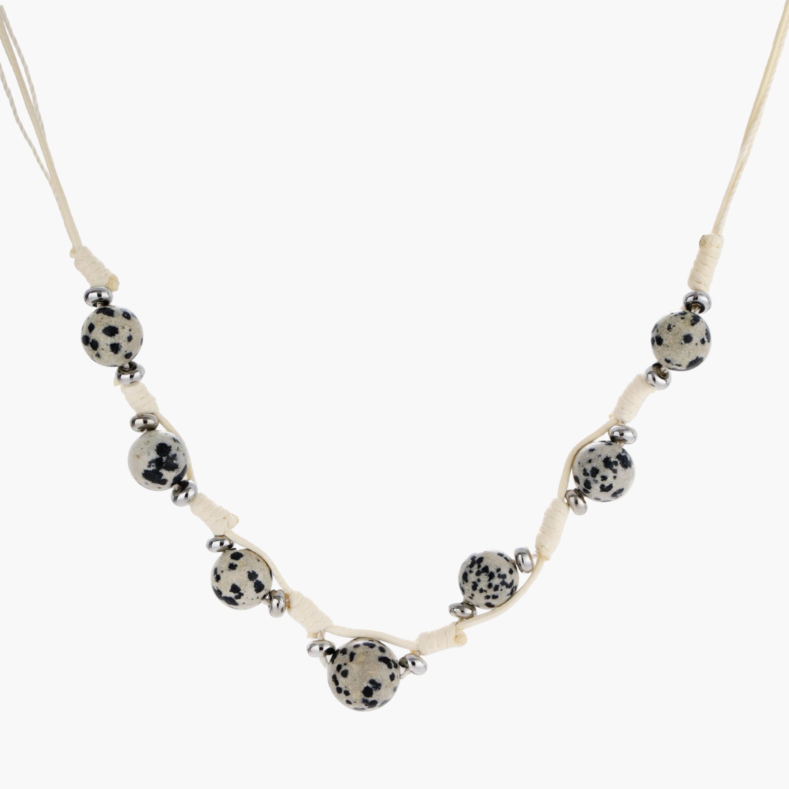 Adjustable cream cord necklace with white spotted stone beads featuring black speckles on neutral background