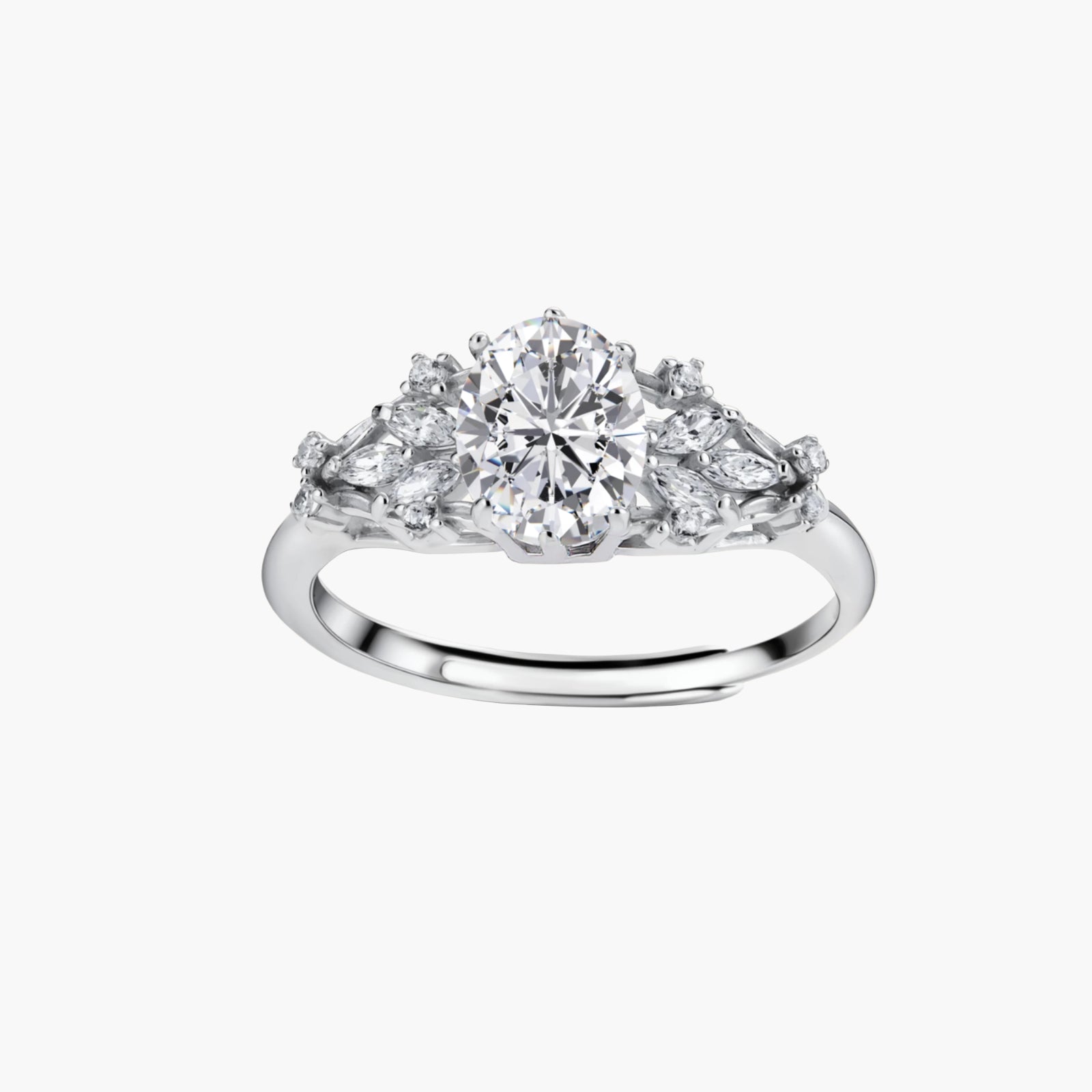 Sterling silver ring with oval moissanite center stone surrounded by smaller accent stones in ornate setting