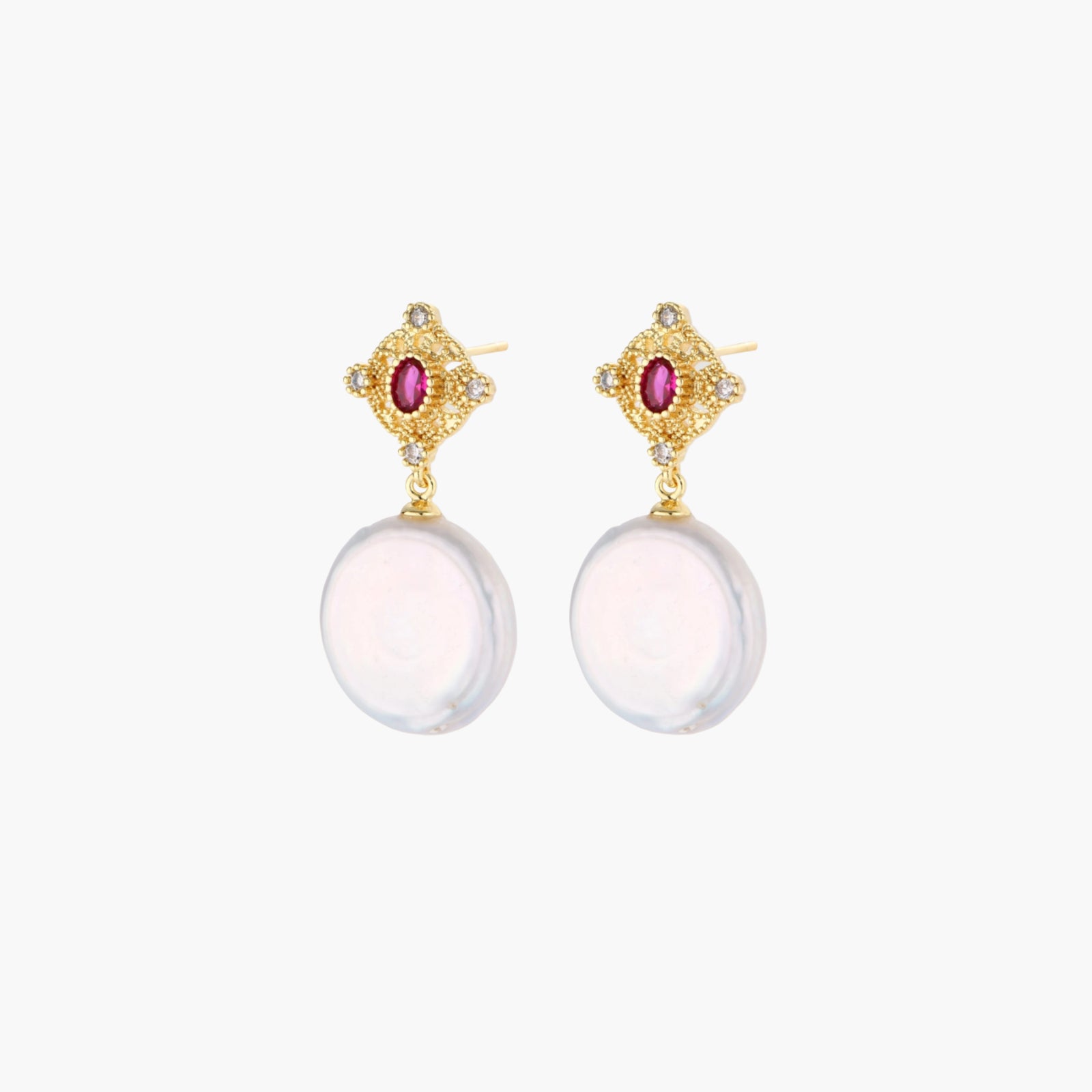 Gold baroque pearl earrings with pink gemstone studs and ornate detailing on cream background.