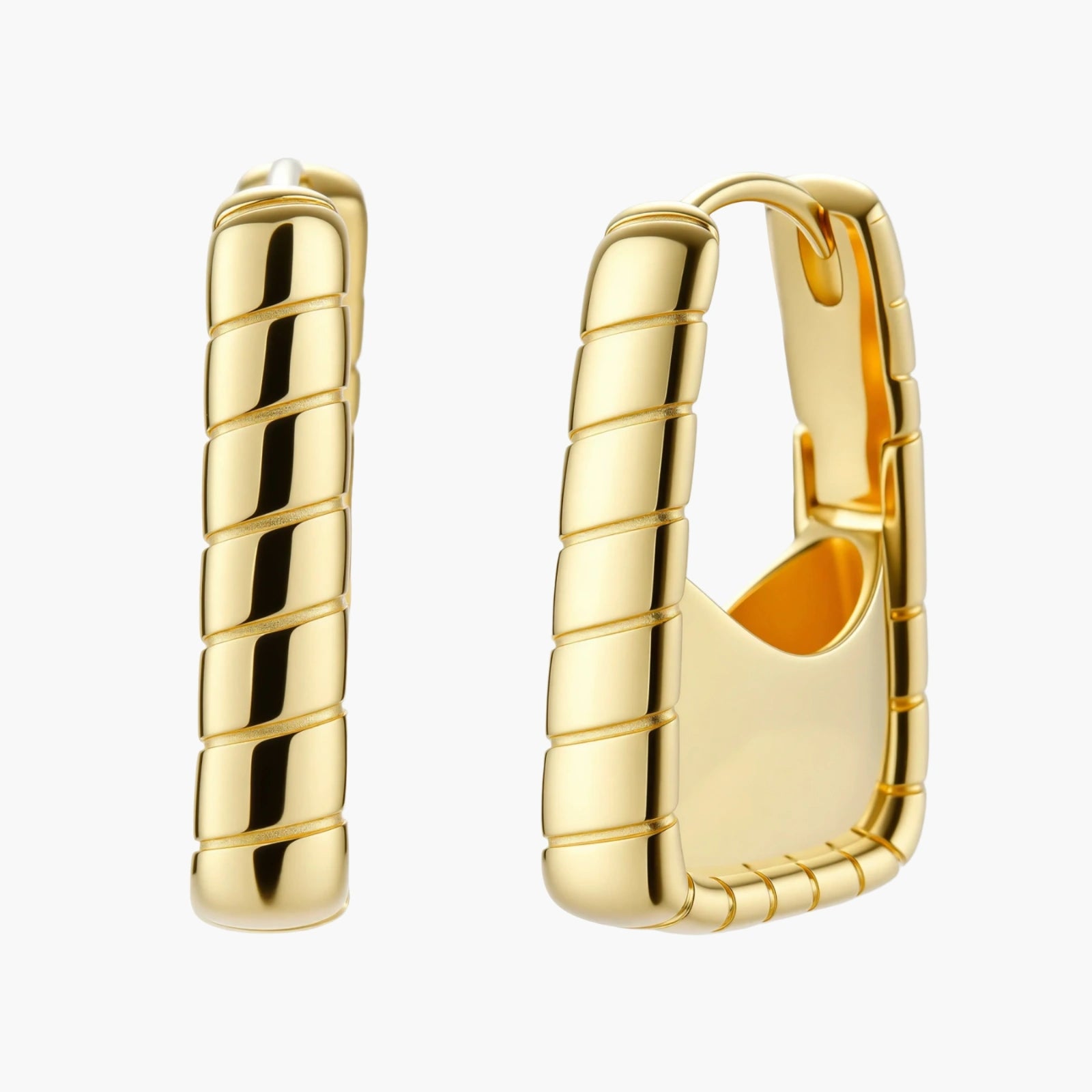 Chunky segmented gold-plated huggie hoop earrings with bamboo-inspired geometric design on white background.