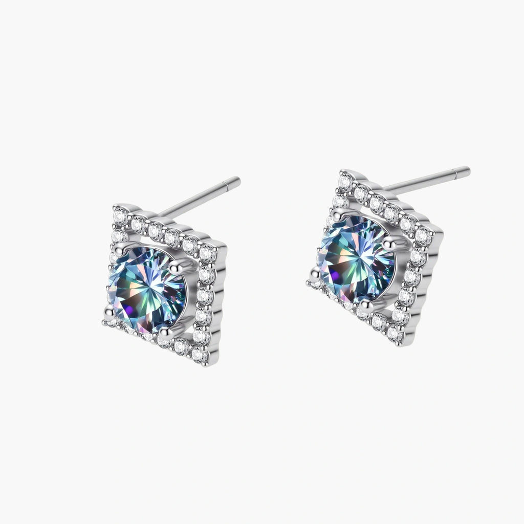 Diamond-shaped sterling silver stud earrings with rainbow moissanite centers surrounded by crystal halos