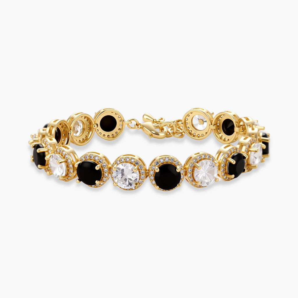 Gold-plated jewelry set with alternating black and clear cubic zirconia stones, featuring necklace, earrings and bracelet