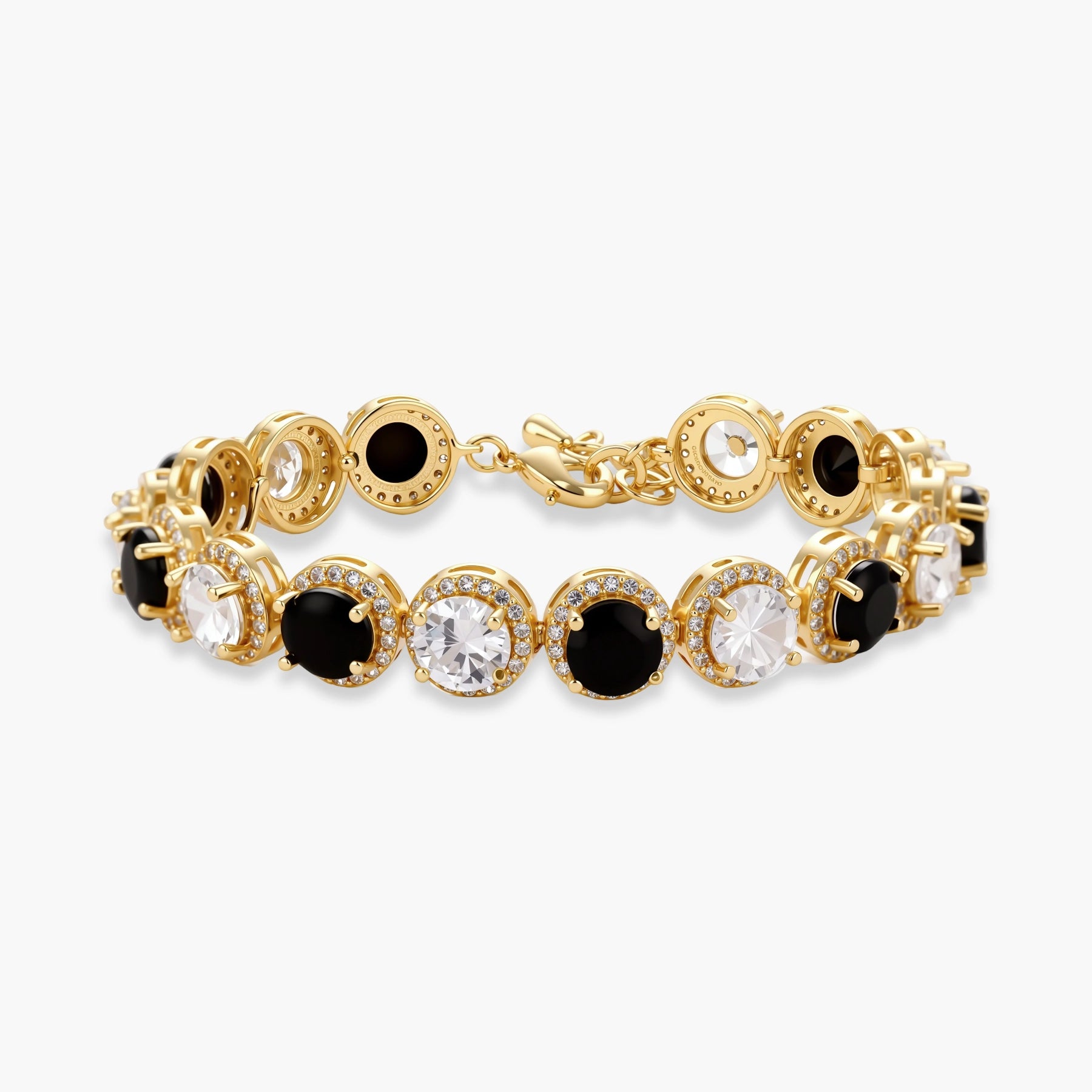 Gold-plated jewelry set with alternating black and clear cubic zirconia stones, featuring necklace, earrings and bracelet