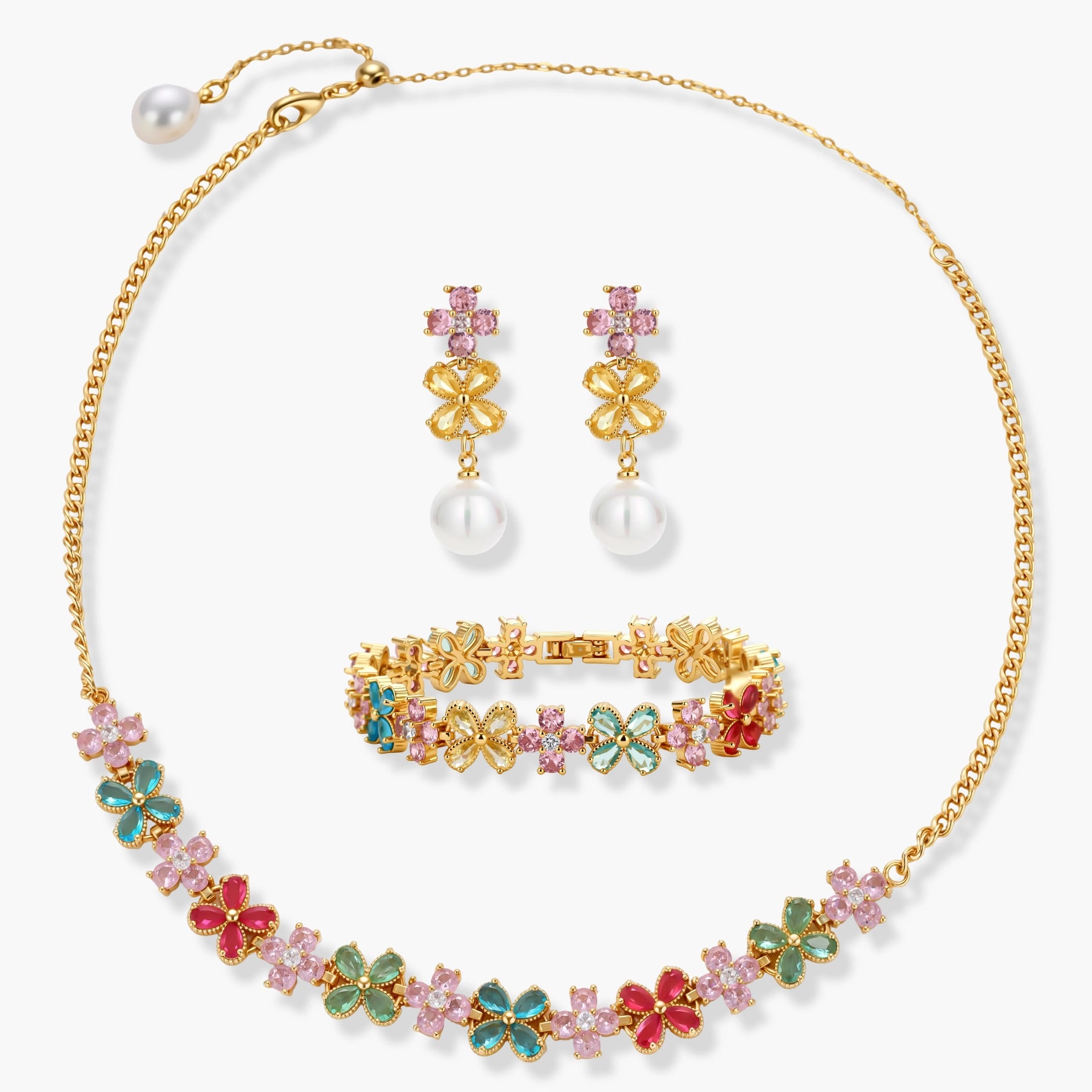 Gold-plated jewelry set with pink, turquoise and red flower-shaped cubic zirconia stones, featuring necklace, earrings and bracelet.