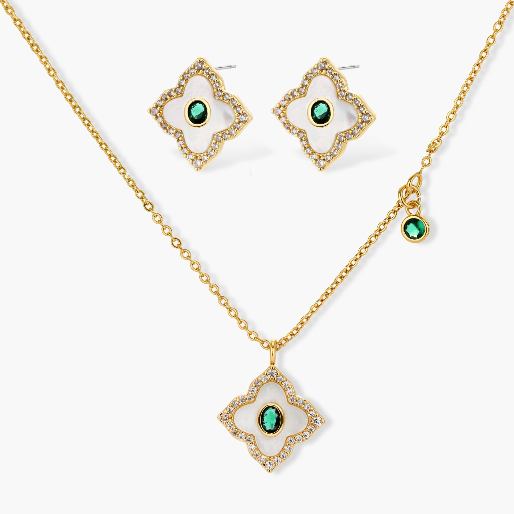 Gold-plated jewelry set with diamond-shaped pendants featuring white centers, green stones, and sparkling zirconia borders