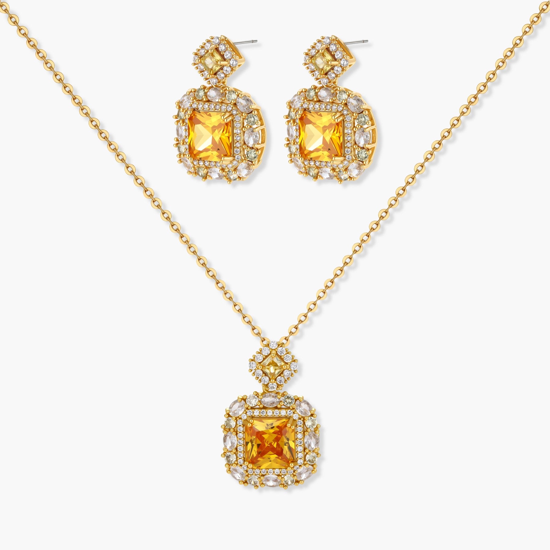 14K gold-plated jewelry set featuring square-cut cubic zirconia stones in ornate layered settings on white background.