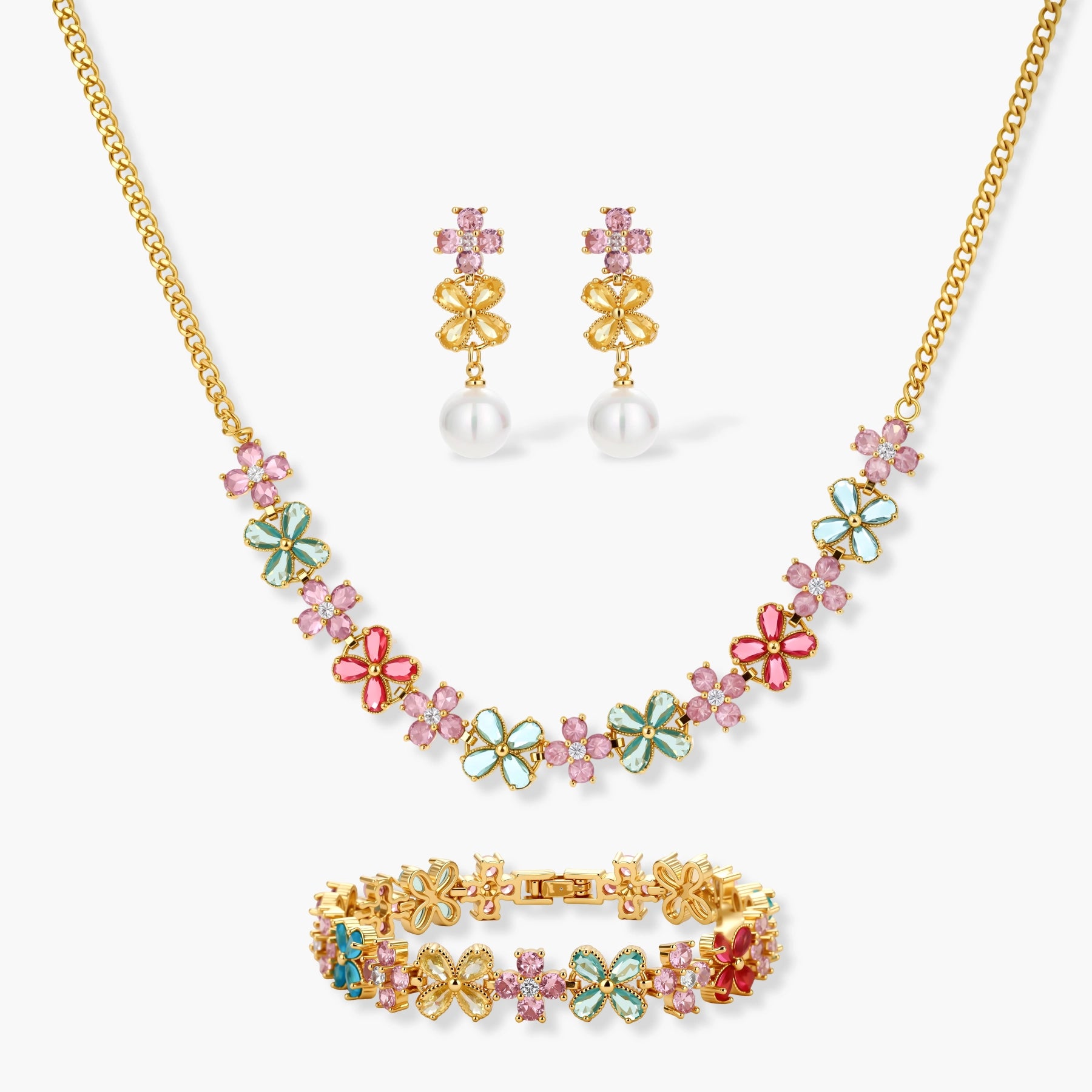 Gold-plated jewelry set with pink, turquoise and red flower-shaped cubic zirconia stones, featuring necklace, earrings and bracelet.